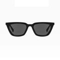 Black sunglasses with dark lenses on a white background