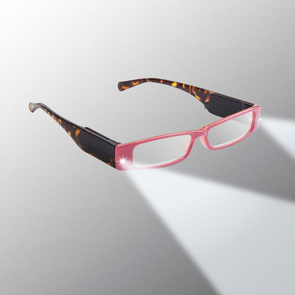 Reading glasses with a pink frame and tortoiseshell arms on a gray background