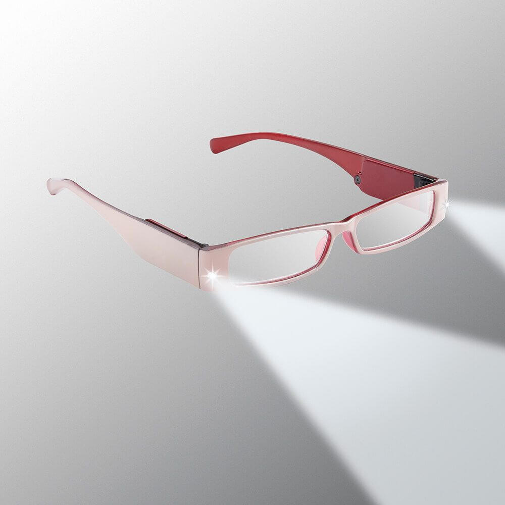 Red and rose gold glasses on a light gray background