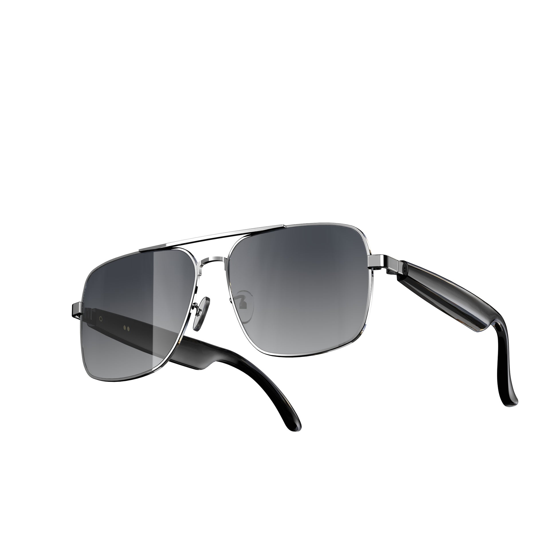 A pair of aviator-style sunglasses with a silver metal frame, dark gray gradient lenses, and black temple arms, shown from a three-quarters angle on a plain white background.