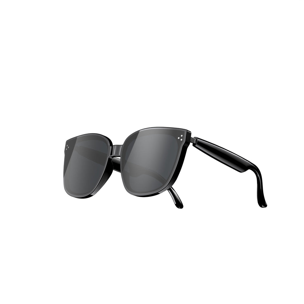 Black sunglasses with thin frame on a light gray background